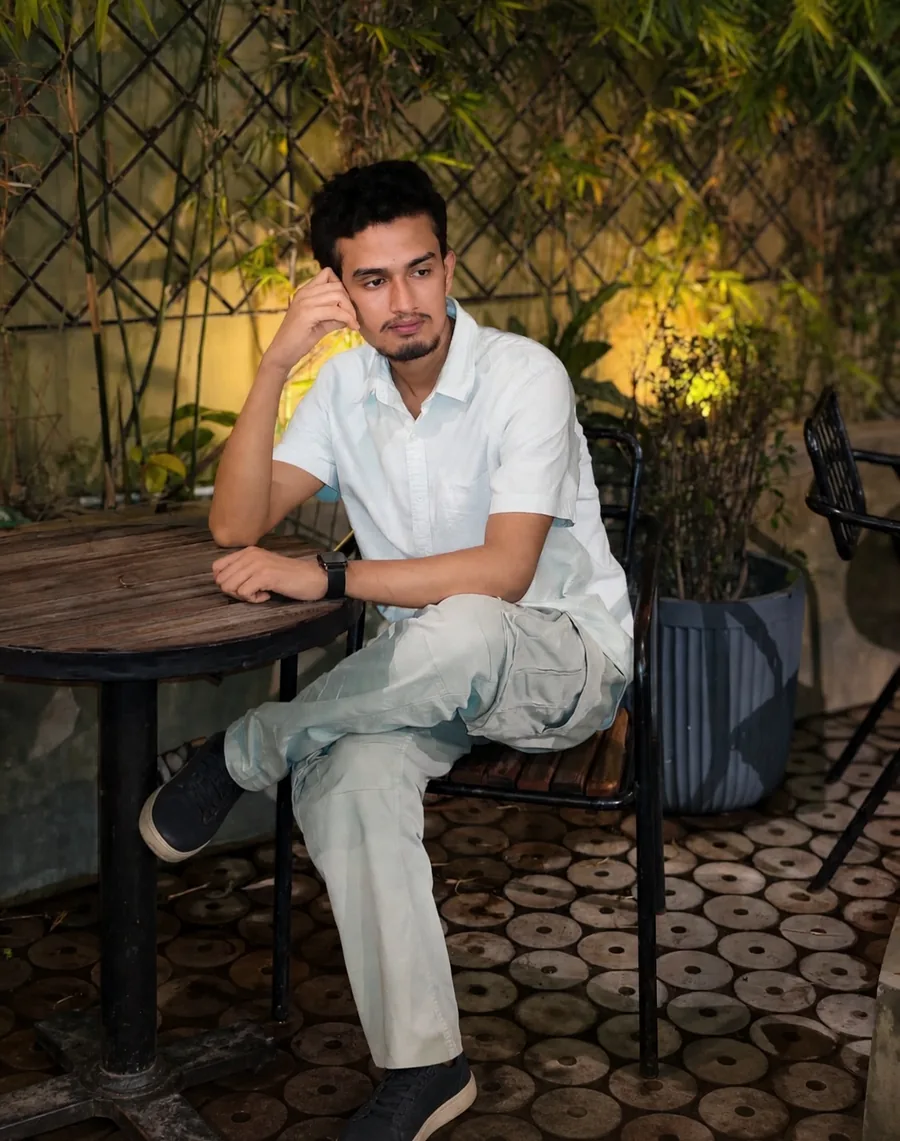 Walid Forhad sitting at a cafe table